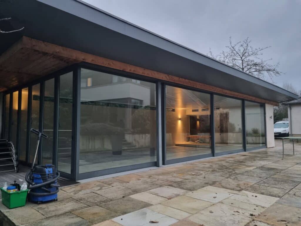 Recently, we tackled a project in Oxford, where the impressive sliding doors to a pool house had developed operational issues due to a dropped head, resulting in jamming and difficult use.