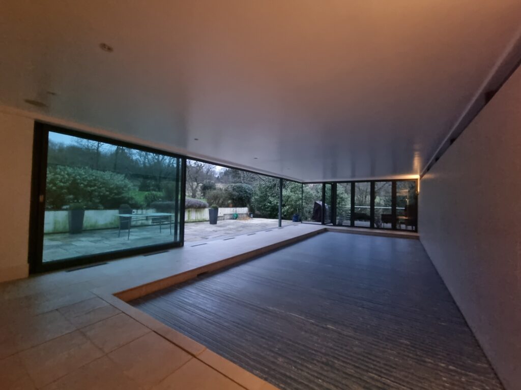 Recently, we tackled a project in Oxford, where the impressive sliding doors to a pool house had developed operational issues due to a dropped head, resulting in jamming and difficult use.