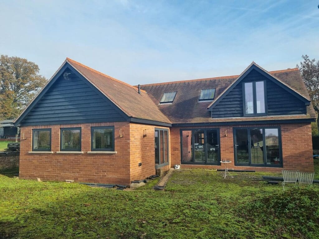 Our recent project in a breathtaking barn conversion in Herefordshire is a perfect example. This standout installation highlights the beauty and performance of Schüco aluminium systems, transforming the space into a masterpiece of style and functionality.