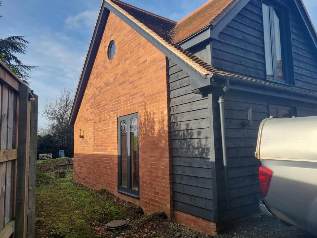 Our recent project in a breathtaking barn conversion in Herefordshire is a perfect example. This standout installation highlights the beauty and performance of Schüco aluminium systems, transforming the space into a masterpiece of style and functionality.