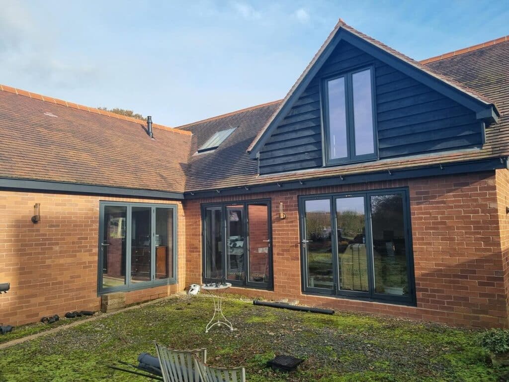 Our recent project in a breathtaking barn conversion in Herefordshire is a perfect example. This standout installation highlights the beauty and performance of Schüco aluminium systems, transforming the space into a masterpiece of style and functionality.