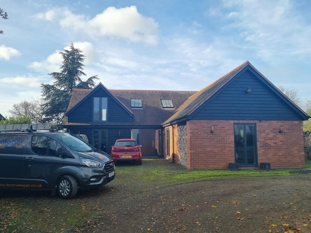 Our recent project in a breathtaking barn conversion in Herefordshire is a perfect example. This standout installation highlights the beauty and performance of Schüco aluminium systems, transforming the space into a masterpiece of style and functionality.