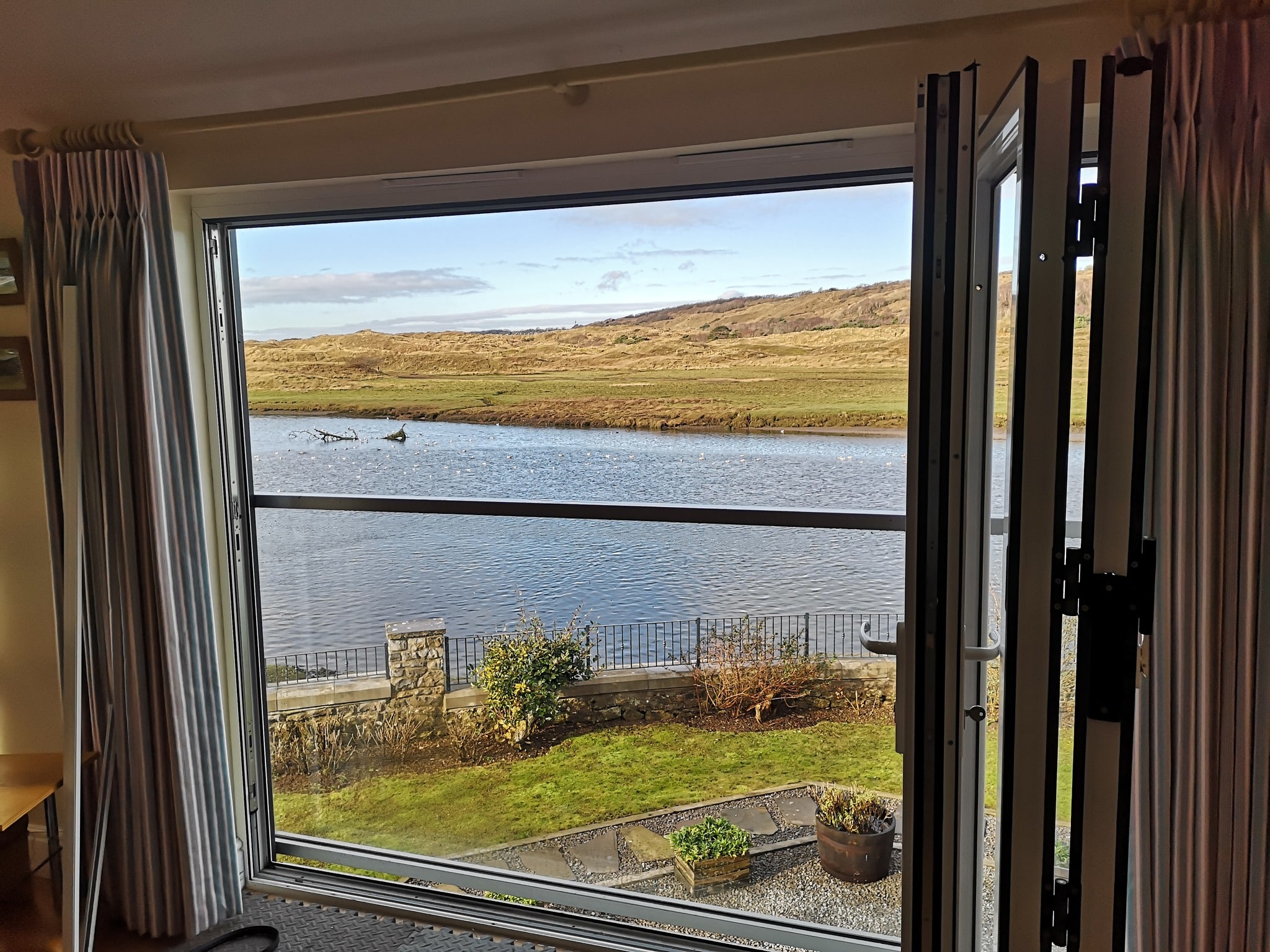 Recently, we had the pleasure of helping a customer whose aluminium bi-fold doors were in dire need of repair. Overlooking the beautiful river Ogmore and the Merthyr Mawr Nature Reserve